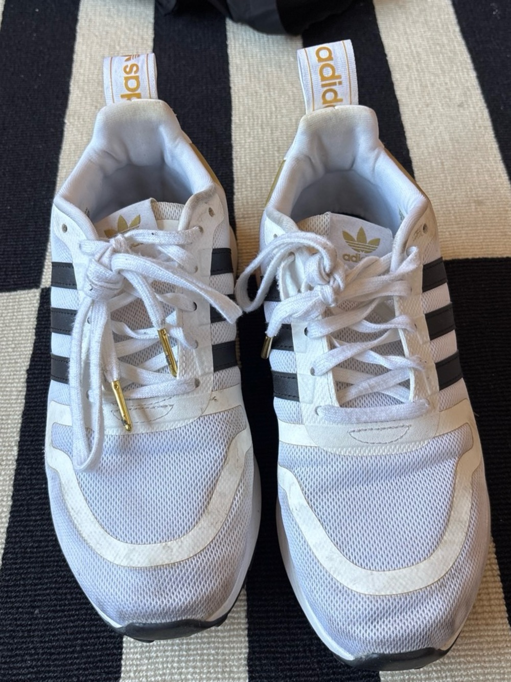 adidas Women’s White Sneakers with Black Stripes and Gold and Snakeprint Accents